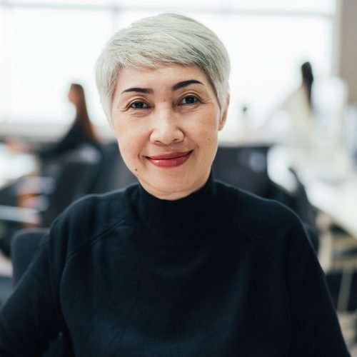 portrait-of-asian-senior-female-manager-at-desk-in-the-office.jpg